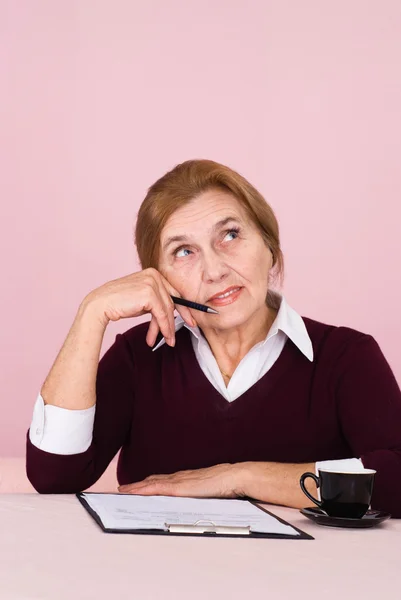 Good elderly Caucasian business woman sitting with a staff — Stock Photo, Image