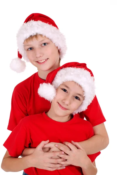 Kleine Brüder mit Weihnachtsmützen — Stockfoto