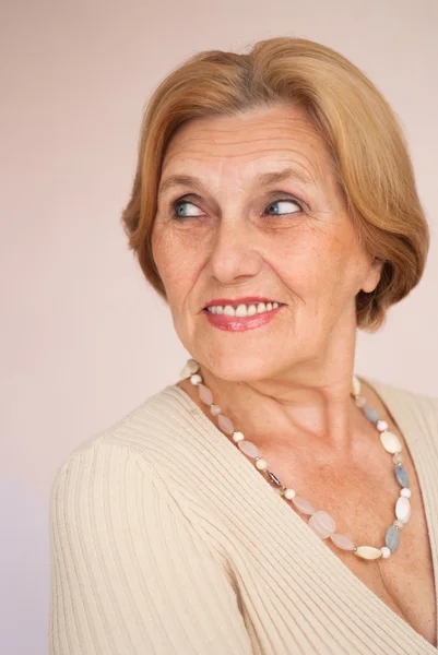 Pretty old woman is resting at home — Stock Photo, Image