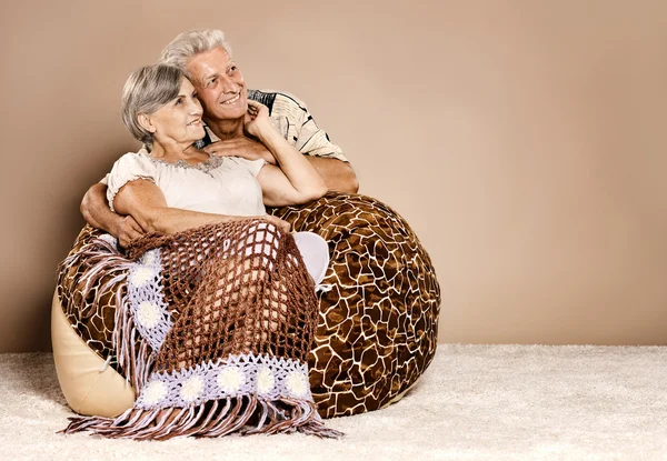 Happy beautiful elderly couple relaxing at home — Stock Photo, Image