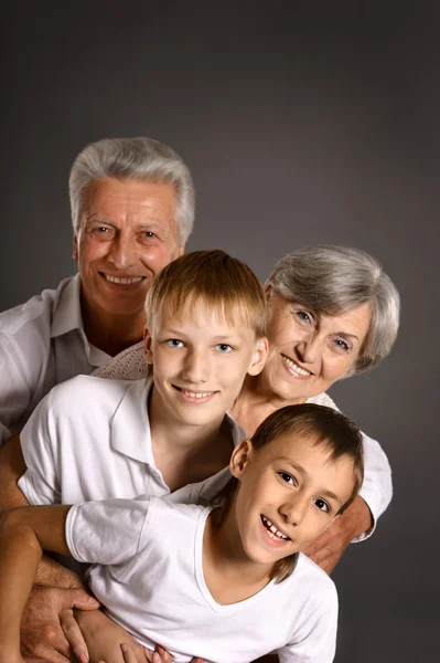Happy family on dark — Stock Photo, Image