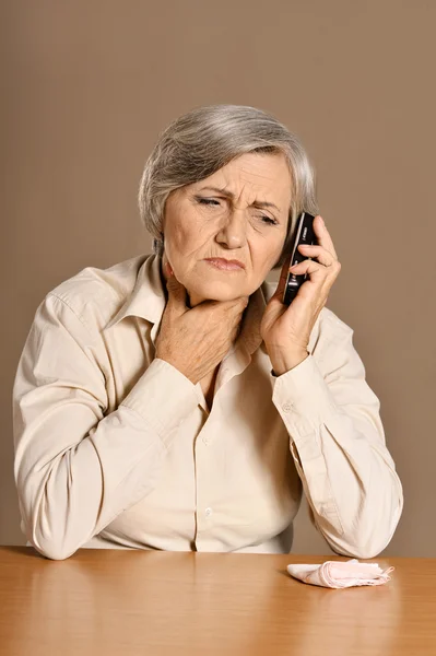 Elderly woman with ill throat — Stock Photo, Image