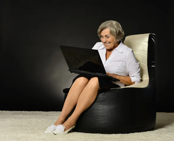 Happy beautiful senior woman with laptop — Stock Photo, Image