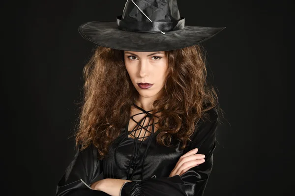 Pretty witch on black Stock Image