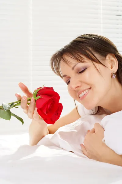 Pretty woman on a bed — Stock Photo, Image