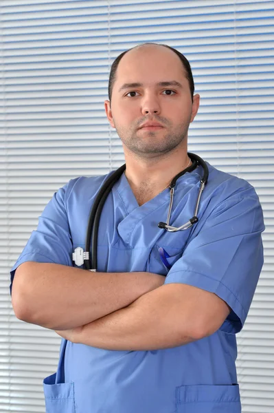 Portrét lékaře v modré uniformě — Stock fotografie
