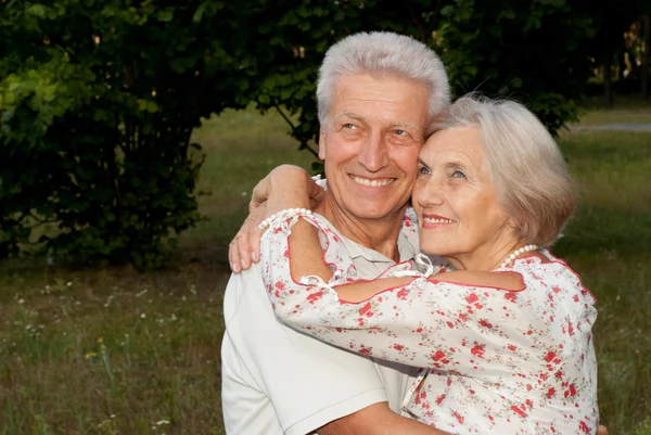 Perfect elderly couple in the garden — Stock Photo, Image