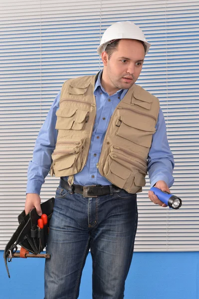 Confident handyman in studio — Stock Photo, Image