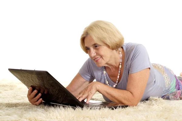 Mature woman relaxing at home — Stock Photo, Image