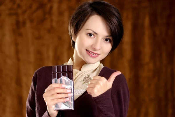 Happy woman with a chocolate — Stock Photo, Image