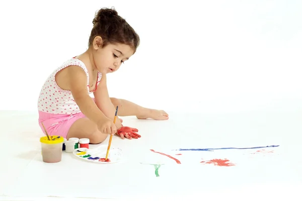 Girl draws on the floor — Stock Photo, Image