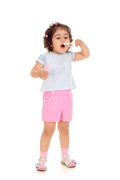 Amusing small girl in a white t-shirt — Stock Photo, Image