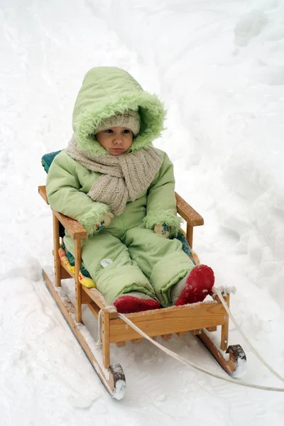 Nice girl rides a sled — Stock Photo, Image