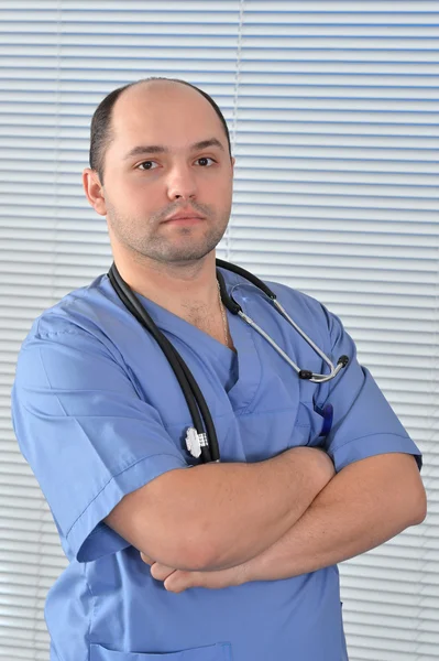 Portrét lékaře v modré uniformě — Stock fotografie