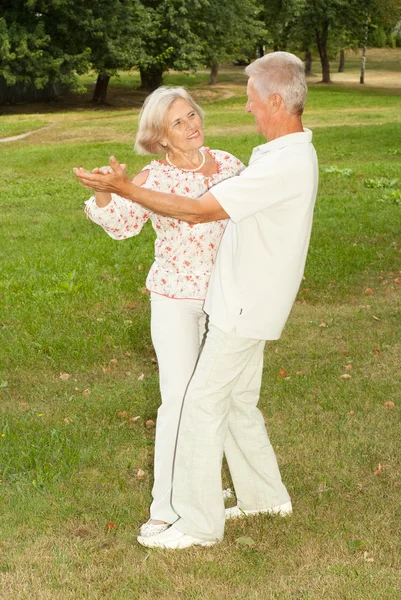 Beauteous elderly people went to the nature — Stock Photo, Image