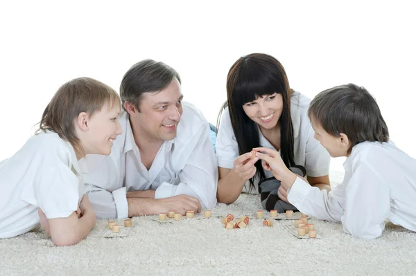 Счастливая семья играет в лотерею — стоковое фото