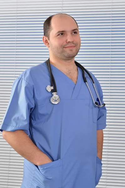 Portrait of a doctor in blue uniform — Stock Photo, Image