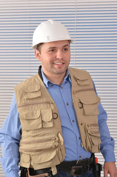 Confident handyman in studio — Stock Photo, Image