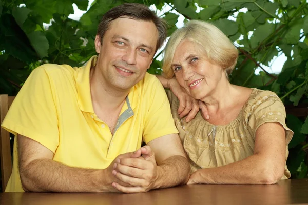 Cute people sitting on the veranda — Stock Photo, Image