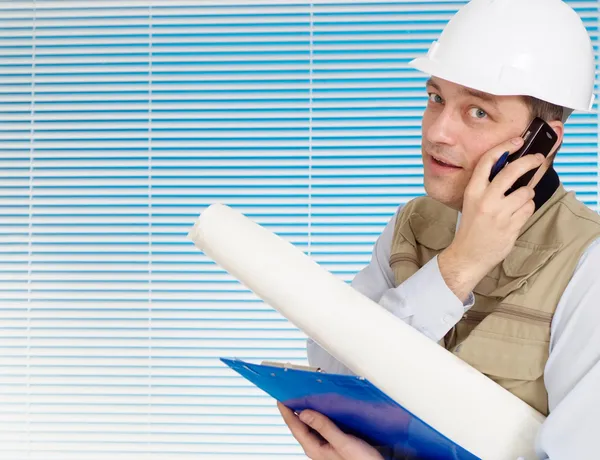 Calling man working in the construction helmet — Stock Photo, Image