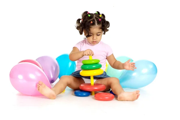 Fille avec des ballons et des jouets — Photo