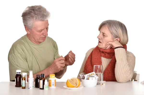 Older man caring for sick woman — Stock Photo, Image