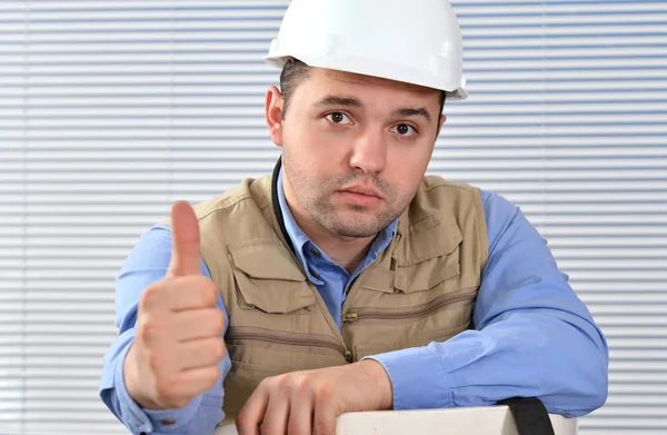 Confident handyman in studio — Stock Photo, Image