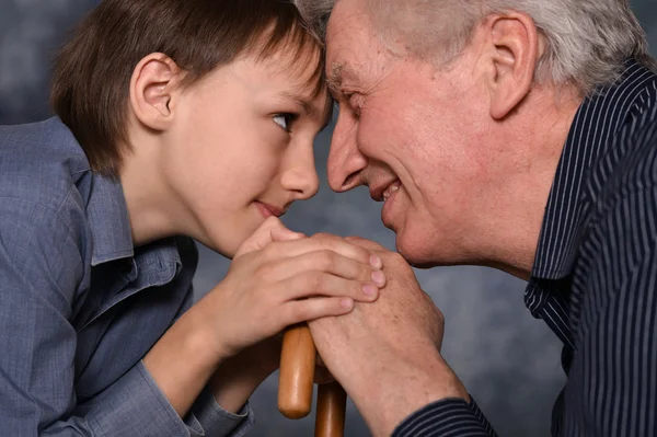 Young boy and his grandfather Royalty Free Stock Images