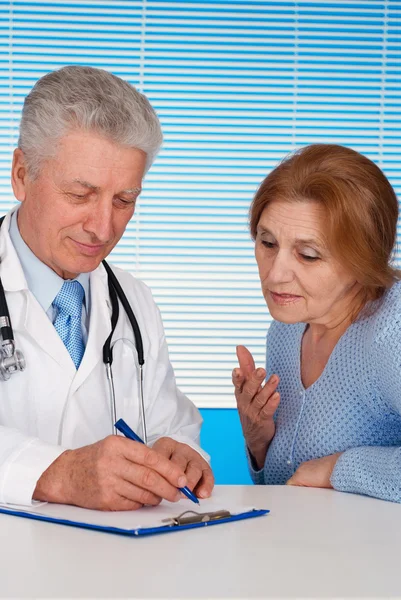Patient and glad doctor Stock Image