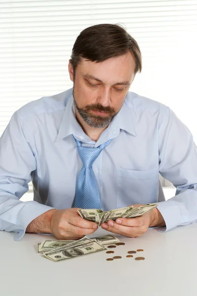 Empresário inteligente em seu escritório — Fotografia de Stock