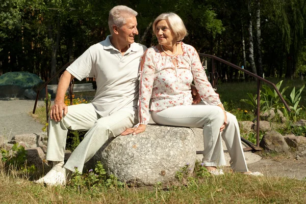 Cute elderly couple in the garden — Stock Photo, Image