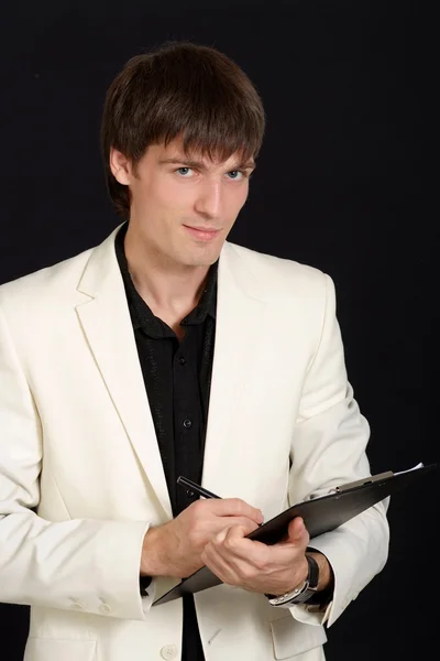 Handsome young man in a white jacket — Stock Photo, Image