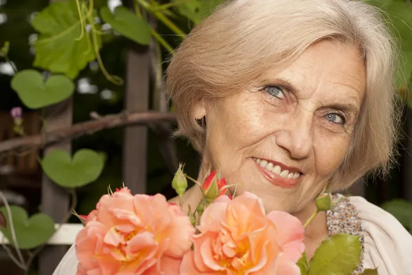 Sweet older woman sitting on the veranda — Stock Photo, Image