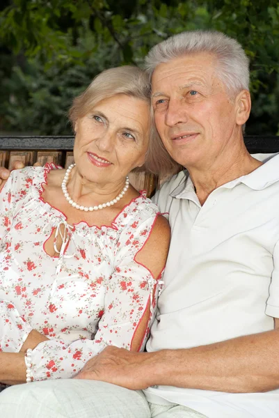 Charming elderly people in the park — Stock Photo, Image