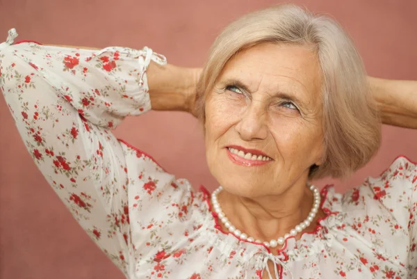 Pretty elderly woman in the town — Stock Photo, Image