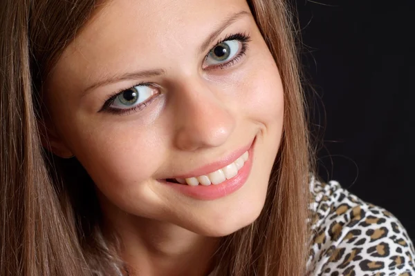 Sympothetic female in a leopard jacket — Stock Photo, Image