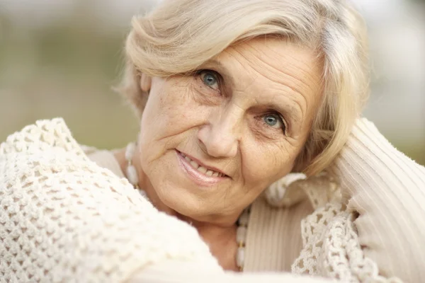 Elderly woman outdoors — Stock Photo, Image