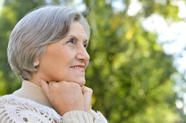 Elderly woman outdoors — Stock Photo, Image