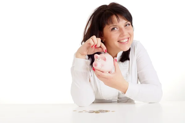 Pretty Caucasian woman with piggy bank sitting — Stock Photo, Image