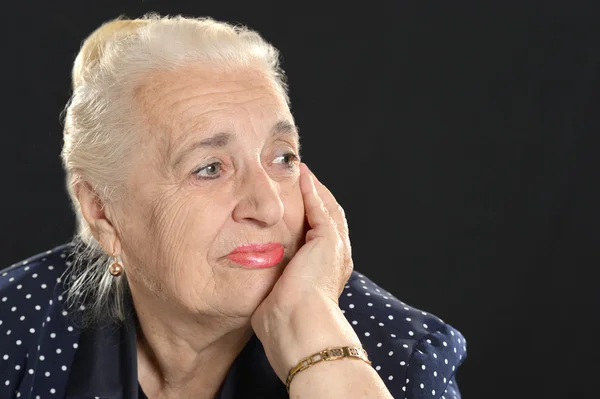 Pensive elderly woman — Stock Photo, Image