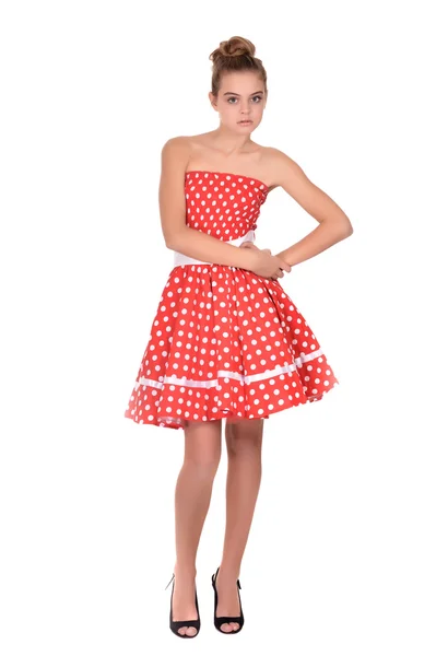 Pretty teenage girl in a red dress — Stock Photo, Image