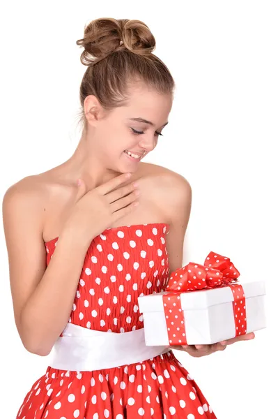 Pretty teenage girl in a red dress — Stock Photo, Image