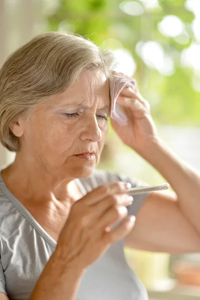 Woman have a temperature — Stock Photo, Image