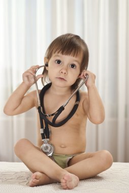 Sweet baby with stethoscope clipart