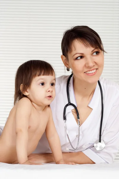 Glad physician with small patient — Stock Photo, Image