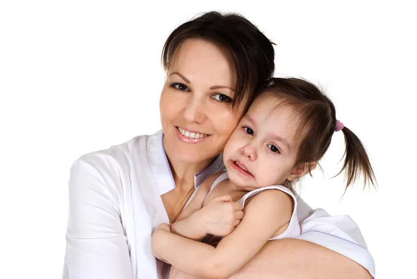 Gute kaukasische Krankenschwester hält ein kleines Mädchen — Stockfoto