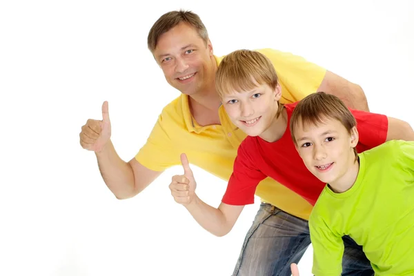 Famiglia giocosa in T-shirt luminose — Foto Stock