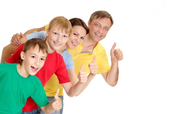 Família agradável em camisetas brilhantes — Fotografia de Stock