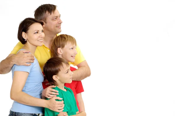 Doce família em camisetas brilhantes — Fotografia de Stock