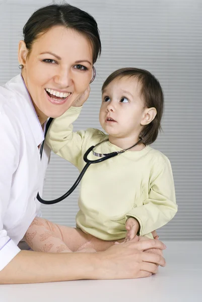 Doctor with little girl Stock Image